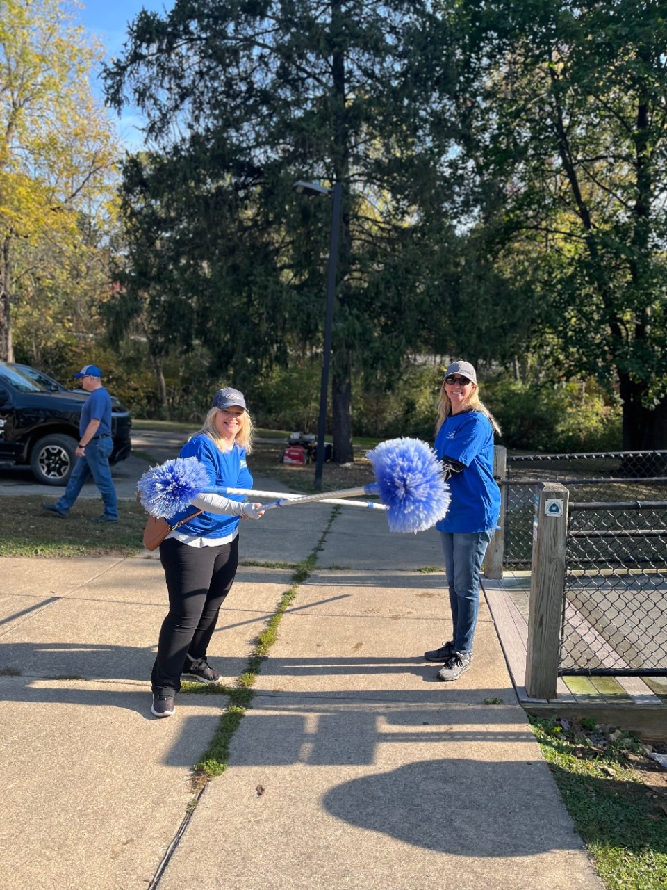 Ford employees holding scrub brushes