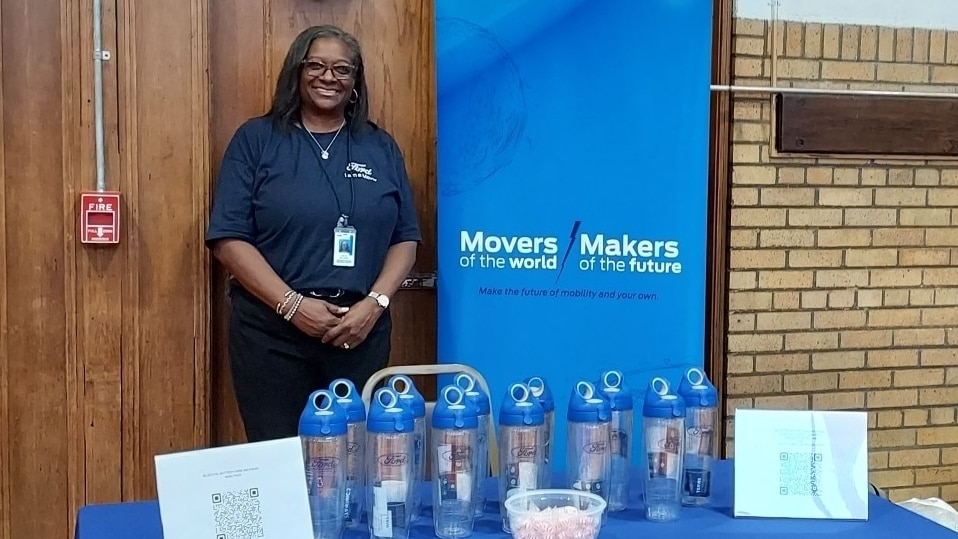 Ford employee recruiting at a table