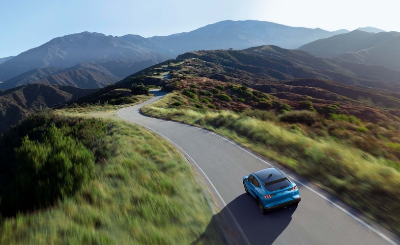 Ford Mustang Mach e on a long winding road