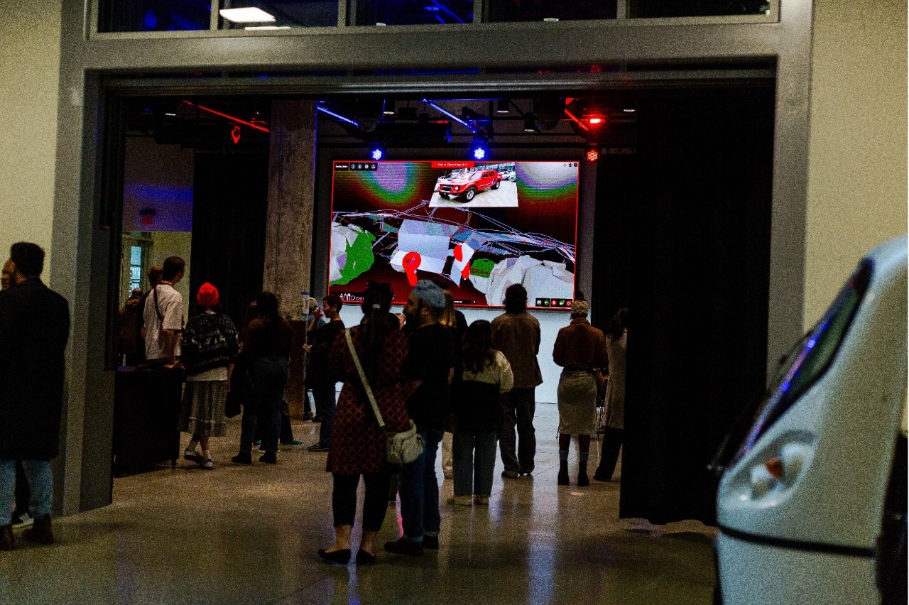group of people milling about dark indoor space