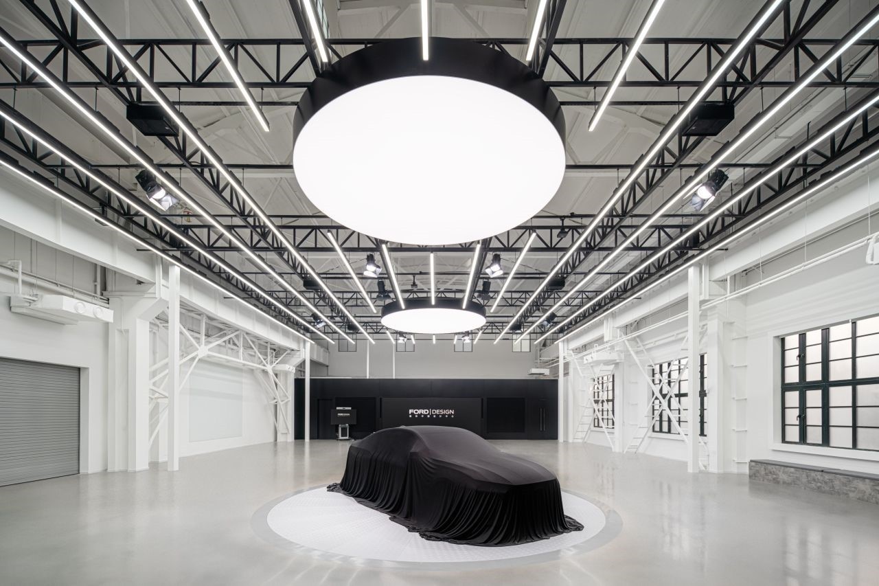 vehicle hidden beneath black curtain