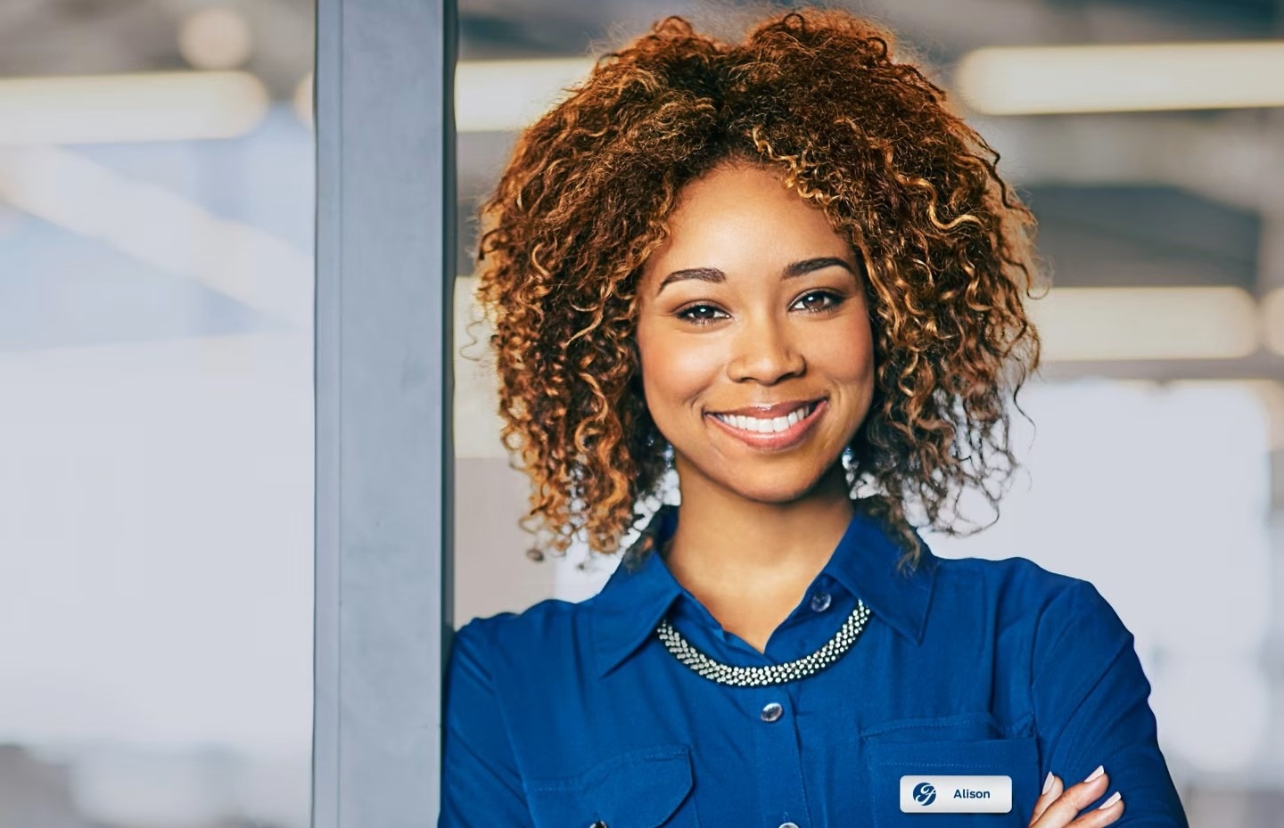 Ford Employee in blue shirt smiling