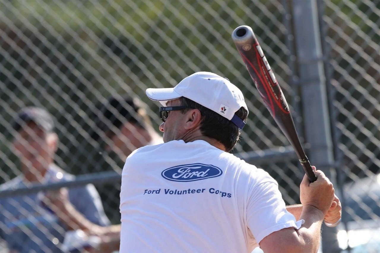 Ford employee playing at baseball event
