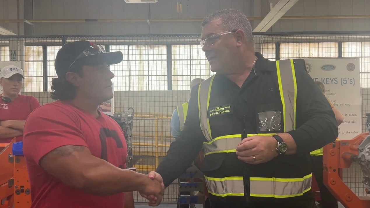 Employee shaking hands with Bryce Currie