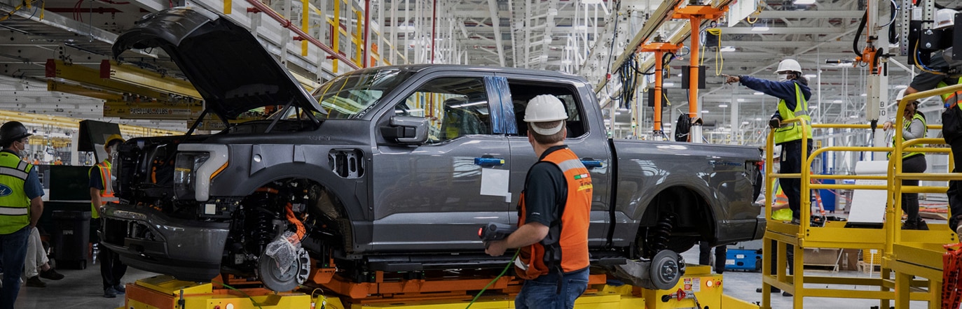 Employees overseeing the build of a Ford truck